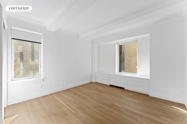 unfurnished bedroom with light wood-type flooring, visible vents, beamed ceiling, and baseboards