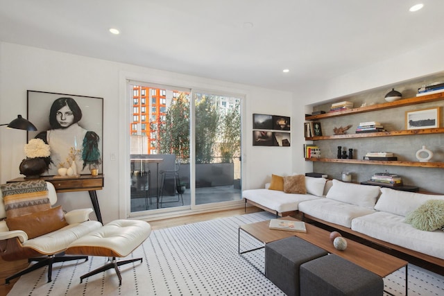 living room with recessed lighting and wood finished floors