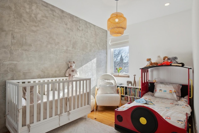 bedroom featuring wood finished floors and recessed lighting