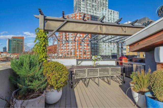 wooden terrace featuring a view of city