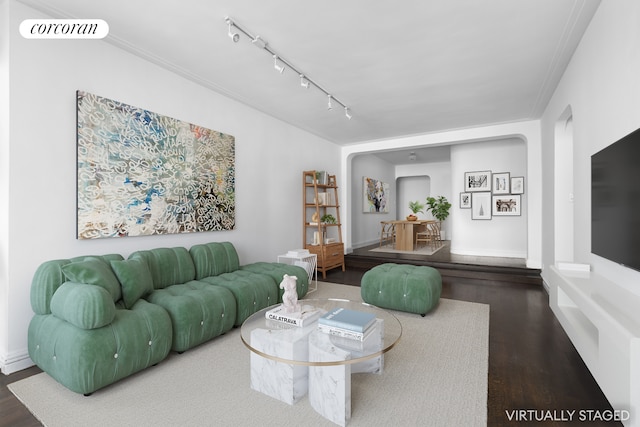 living room with ornamental molding, visible vents, track lighting, and wood finished floors