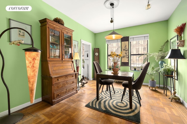 dining room featuring baseboards and visible vents