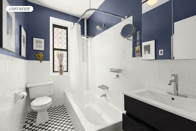 69 Tiemann Pl Unit 12, New York City, NY 10027 - bathroom featuring tile walls, vanity, shower / bath combo, tile patterned floors, and a wainscoted wall