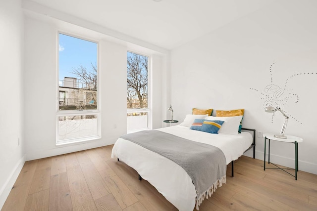 bedroom with light wood-style floors