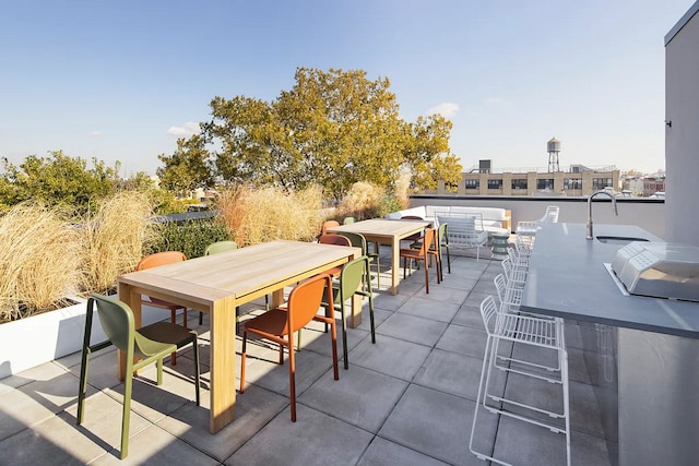 view of patio with outdoor dining area and a bar