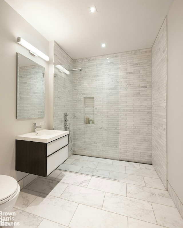 full bathroom featuring marble finish floor, recessed lighting, toilet, vanity, and walk in shower