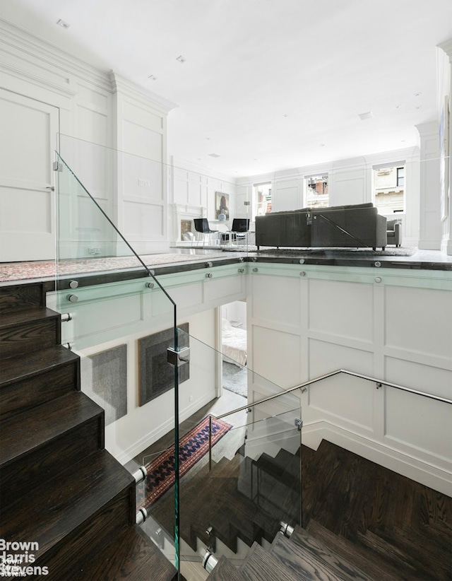 stairs featuring wood finished floors