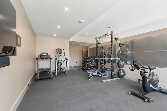 workout area with recessed lighting and baseboards