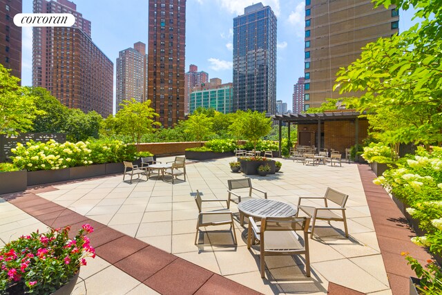 view of patio / terrace with a city view and a pergola