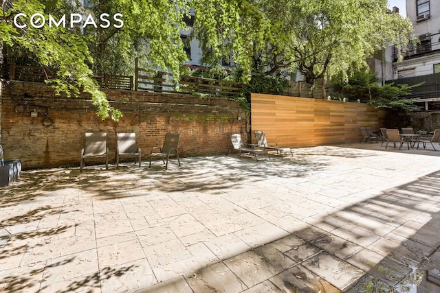 view of patio with fence
