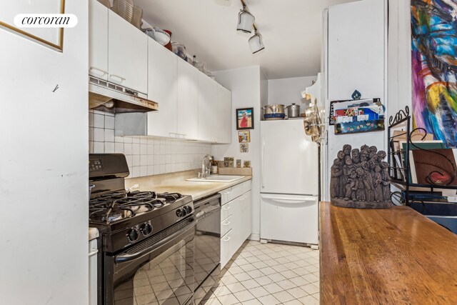 kitchen featuring a sink, under cabinet range hood, black appliances, white cabinetry, and backsplash