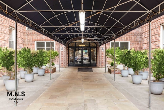 entrance to property with french doors and brick siding