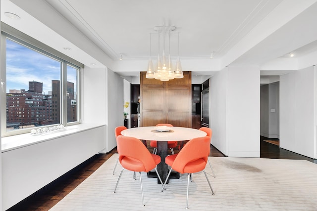 dining area featuring dark wood-style floors and a view of city