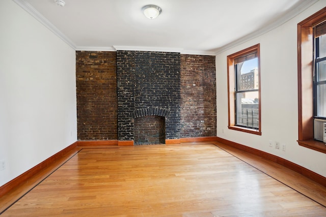 839 W End Ave Unit 7C, New York City, NY 10025 - unfurnished living room featuring ornamental molding, wood finished floors, and a large fireplace
