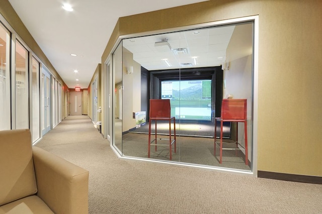 corridor featuring carpet flooring, recessed lighting, and baseboards