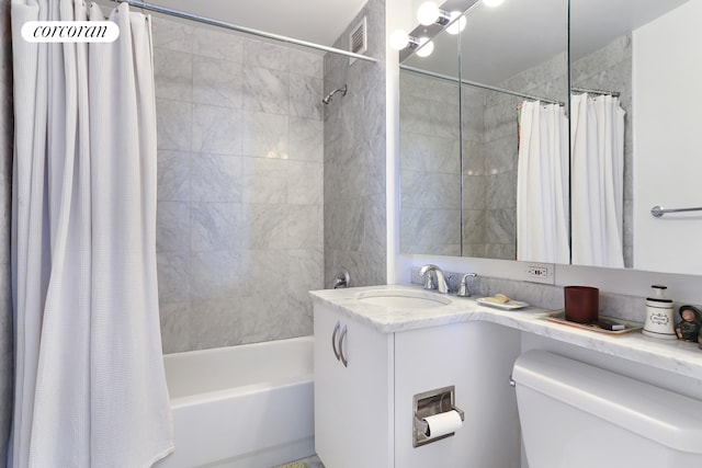 bathroom featuring toilet, shower / tub combo with curtain, and vanity