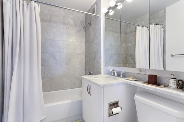 bathroom with shower / bath combination with curtain, vanity, and toilet