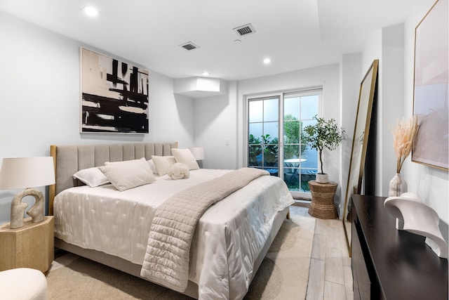 bedroom featuring recessed lighting, light wood-type flooring, visible vents, and access to exterior