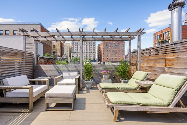 wooden terrace featuring an outdoor living space and a pergola