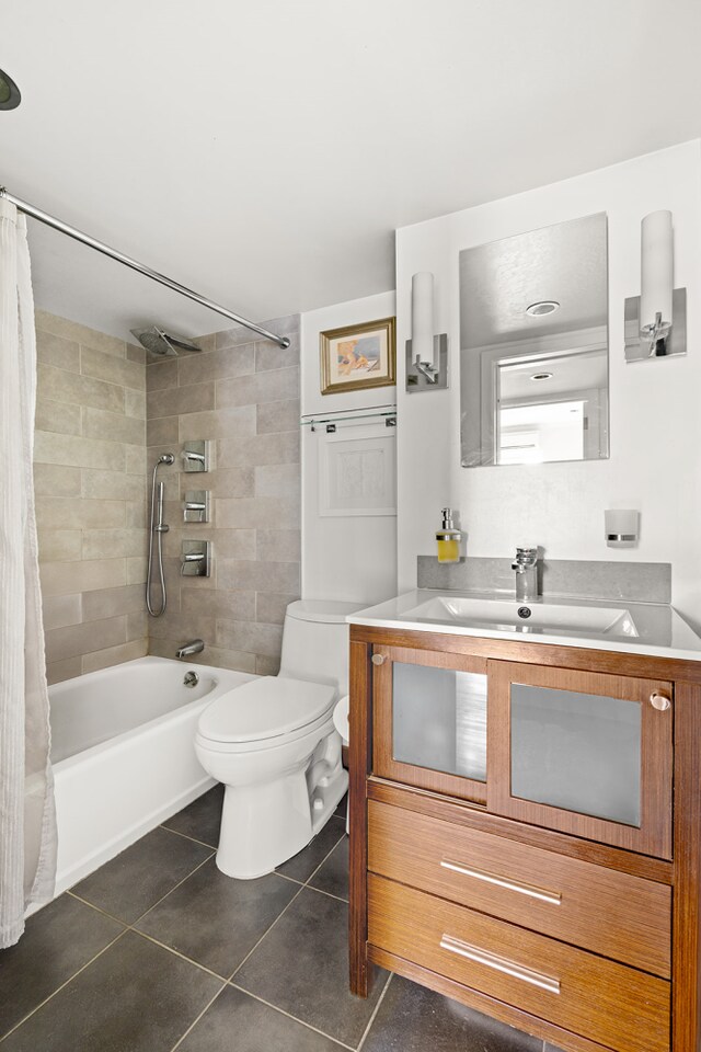 full bathroom featuring shower / bath combo with shower curtain, vanity, toilet, and tile patterned floors