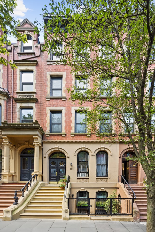 view of building exterior with a fenced front yard