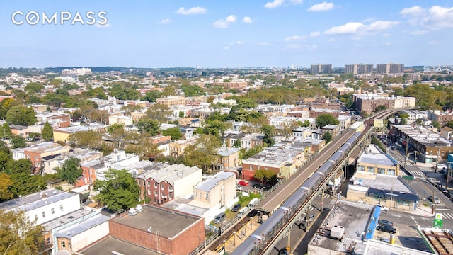 birds eye view of property with a city view