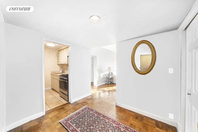 405 E 63rd St Unit 10J, New York City, NY 10065 - hallway featuring baseboards and a sink
