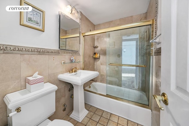 405 E 63rd St Unit 10J, New York City, NY 10065 - full bath with toilet, tile walls, and bath / shower combo with glass door