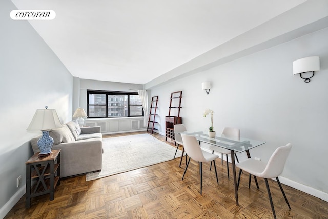 405 E 63rd St Unit 10J, New York City, NY 10065 - dining room featuring baseboards