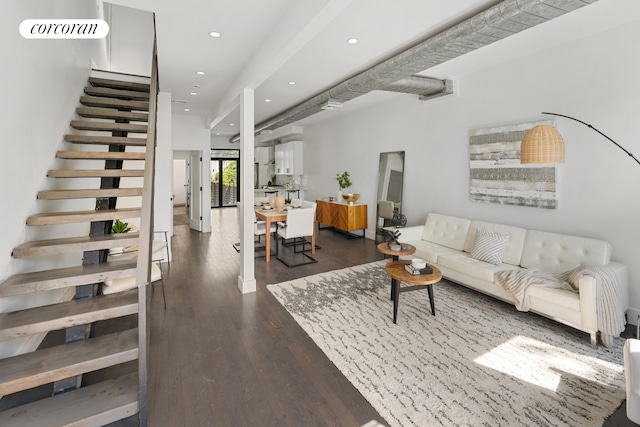 living room featuring recessed lighting, stairway, and dark wood-style flooring