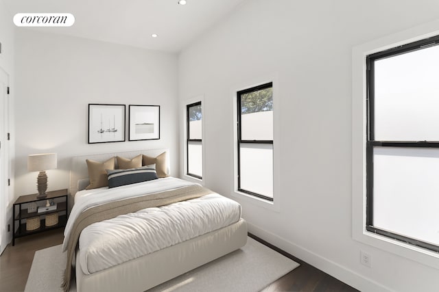 bedroom with dark wood-style floors, recessed lighting, visible vents, and baseboards