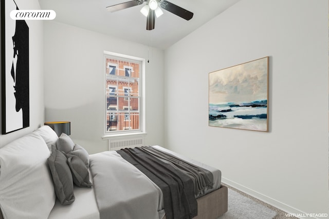 bedroom featuring a ceiling fan, light colored carpet, and baseboards