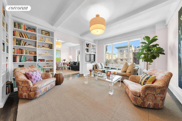 living area featuring built in shelves, visible vents, and beamed ceiling