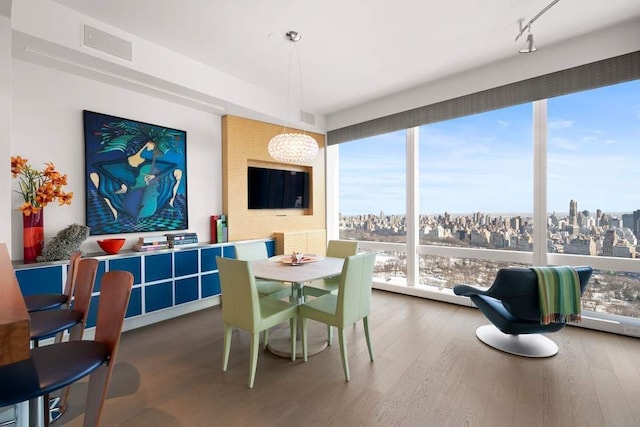 25 Columbus Cir Unit 59D, New York City, NY 10019 - dining space featuring wood finished floors