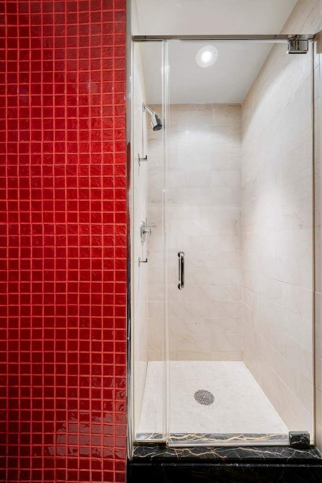 full bathroom with a shower stall