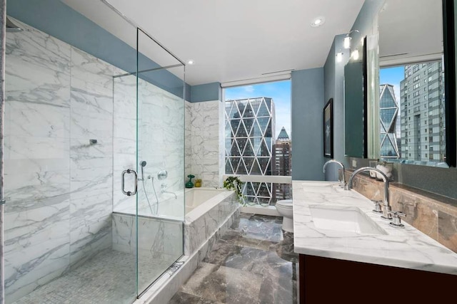 bathroom featuring a marble finish shower, toilet, a garden tub, marble finish floor, and a sink