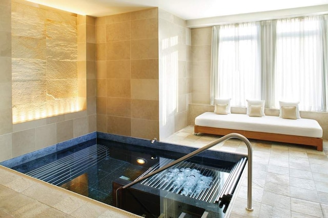 sauna / steam room with healthy amount of natural light
