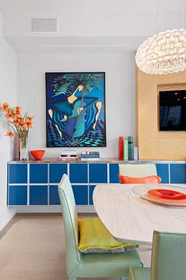 dining area featuring wood finished floors and baseboards