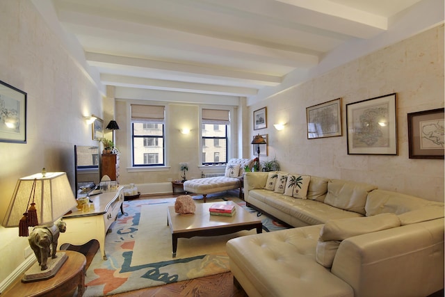 living room with beam ceiling and wood finished floors