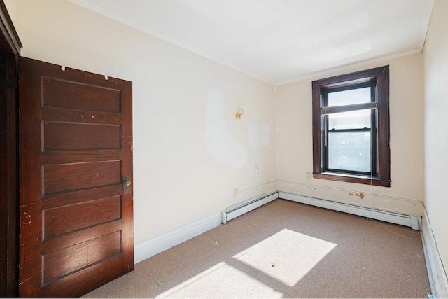 unfurnished room with a baseboard radiator and baseboards