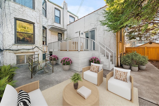 view of patio / terrace featuring an outdoor hangout area and fence