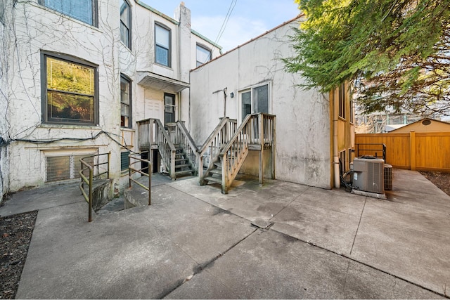 view of patio featuring fence and central air condition unit