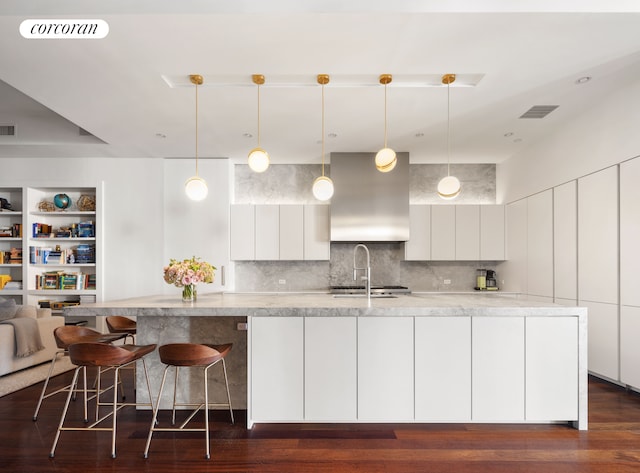 kitchen with white cabinetry, light countertops, visible vents, and modern cabinets