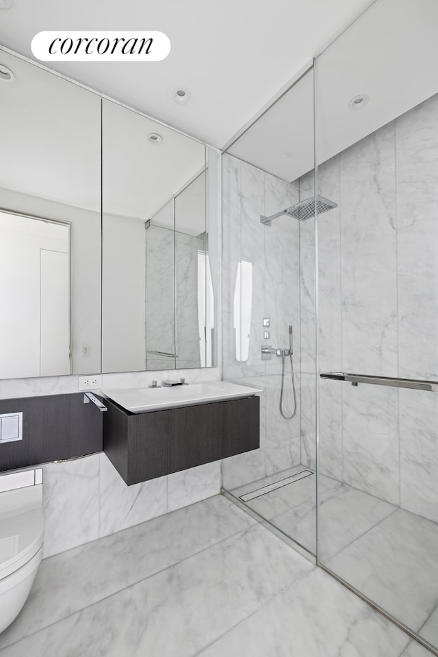 520 W 28th St Unit 29, New York City, NY 10001 - bathroom featuring a marble finish shower and vanity