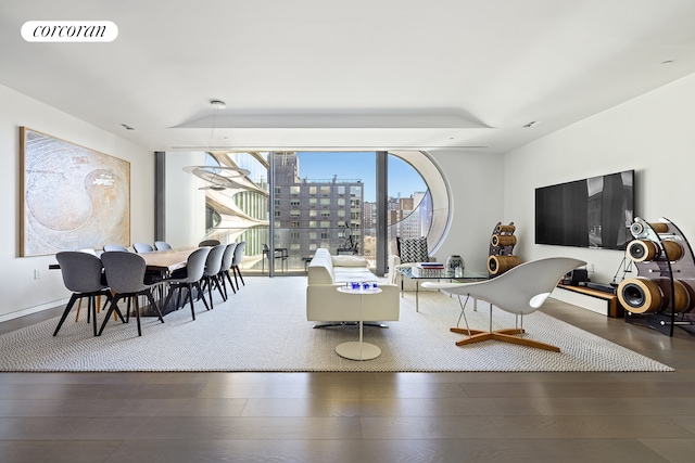 living room featuring visible vents and dark wood-style flooring