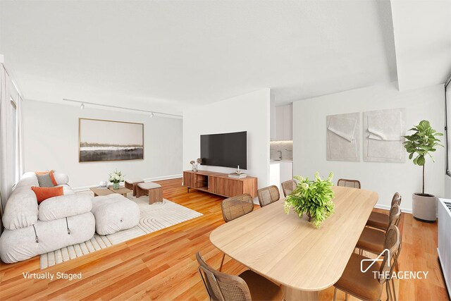 170 Park Row Unit 7C, New York City, NY 10038 - living area featuring light wood-style flooring and baseboards