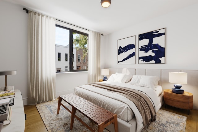 bedroom with light wood finished floors