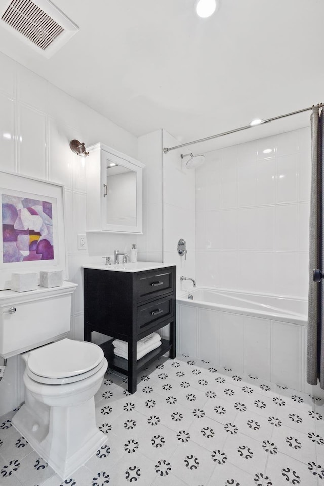 full bathroom featuring visible vents, toilet, vanity, shower / tub combination, and tile patterned flooring