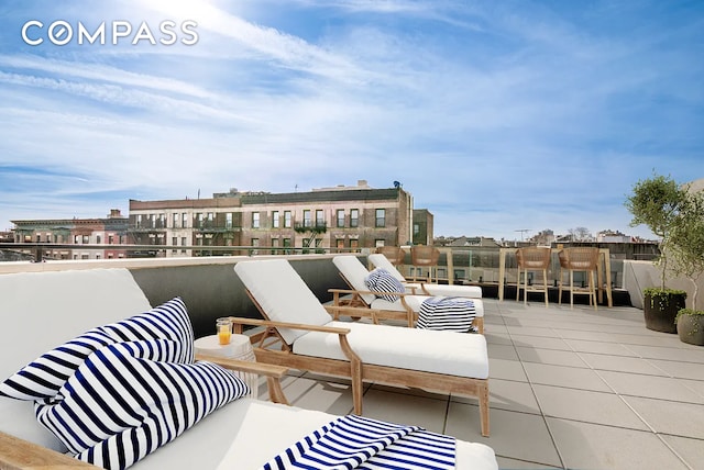 view of patio / terrace with an outdoor living space and a balcony