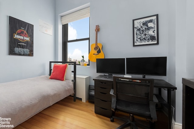 365 Bridge St Unit 22C, New York City, NY 11201 - bedroom with light wood-style floors and a desk